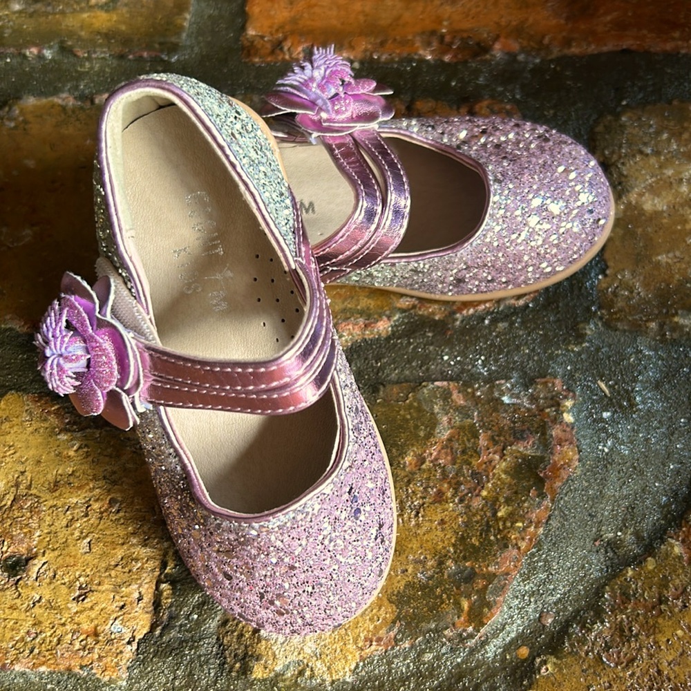 Eight KM fancy glitter shoes.